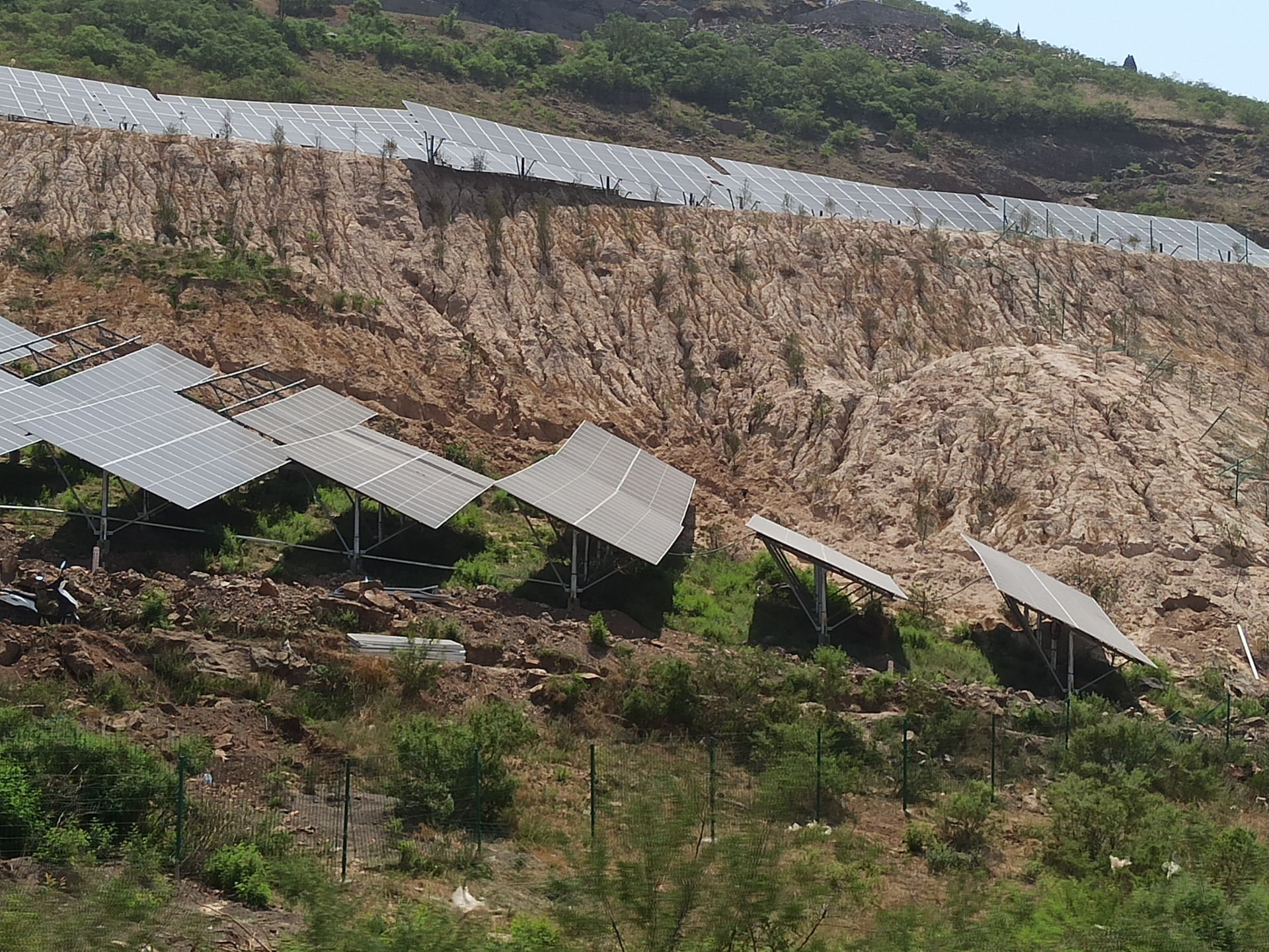Large-scale reflective and photovoltaic array on a hillside research site in China