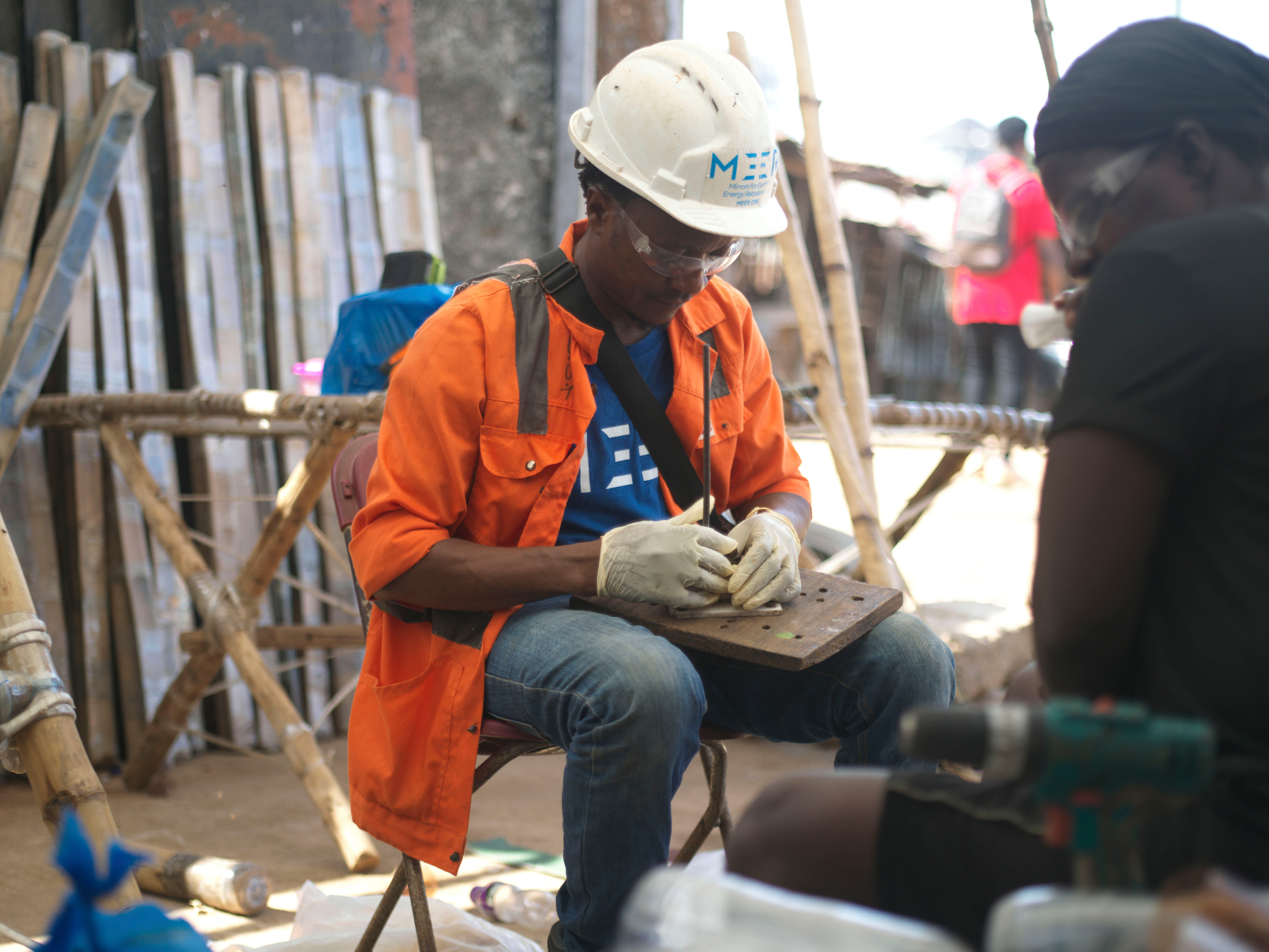 MEER team member preparing components in the workshop