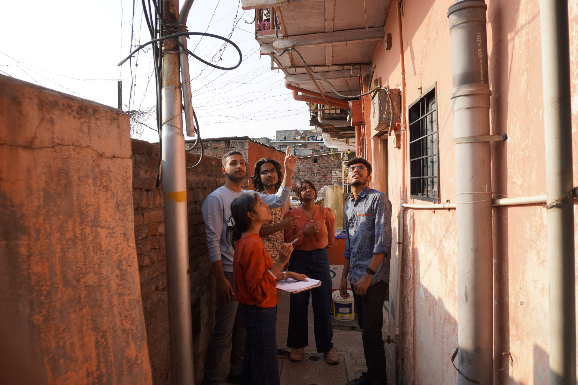 MEER team surveying homes in an urban neighborhood for sensor placement